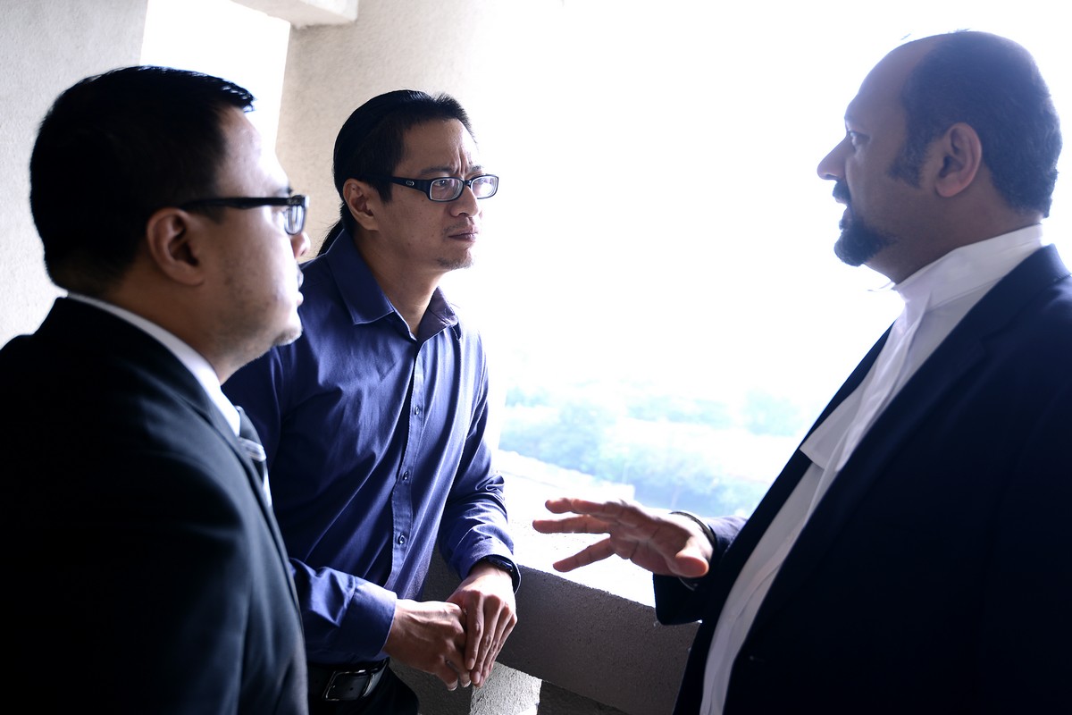 Azmi Sharom (centre) discussing with his lawyer, Gobind Singh Deo (right), at the Jalan Duta court yesterday. Sharom claimed trial in the Sessions Court over his remarks on the Perak constitutional crisis. – The Malaysian Insider pic by Afif Abd Halim, September 3, 2014.