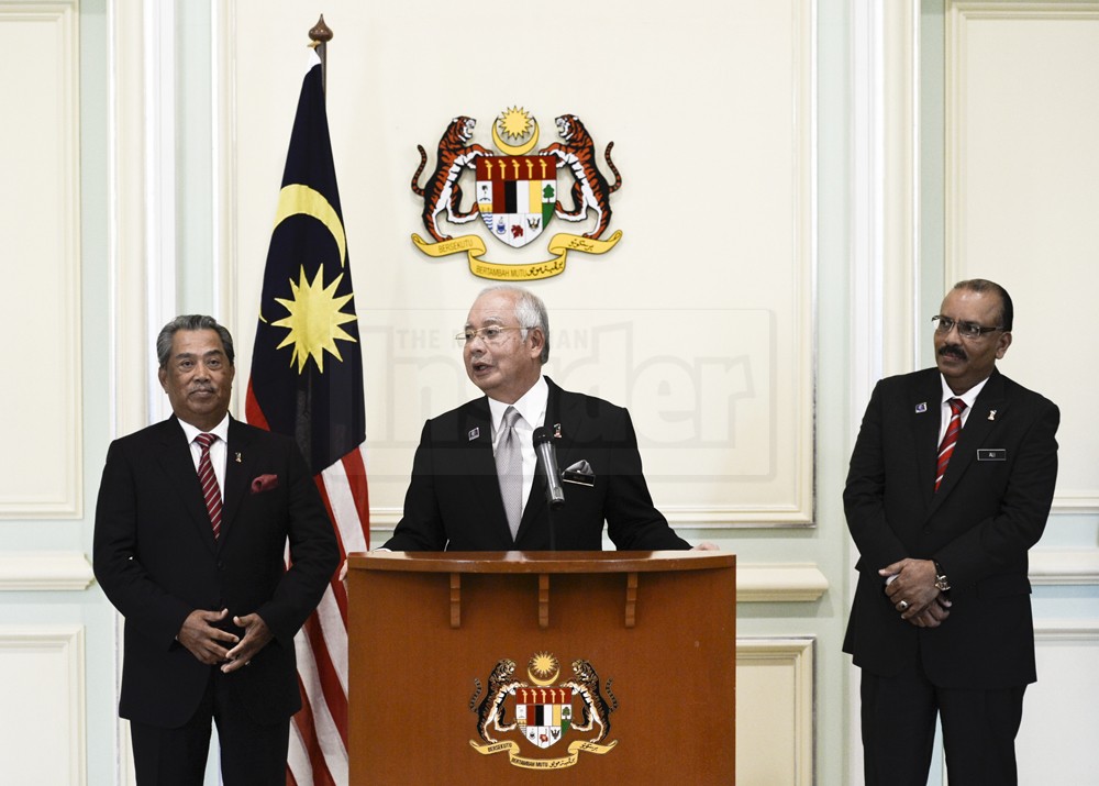 Prime Minister Datuk Seri Najib Razak (centre) announces the minor reshuffling of the Cabinet today in Putrajaya. – The Malaysian Insider pic by Nazir Sufari, June 25, 2014.