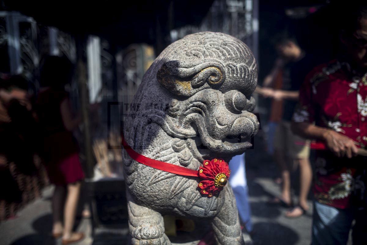 A red ribbon is tied around a statue at the Goddess of Mercy temple in George Town, Penang. – The Malaysian Insider pic by Hasnoor Hussain, February 22, 2015.