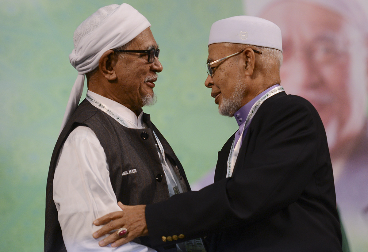 PAS president Datuk Seri Abdul Hadi Awang with party supreme leader Datuk Haron Din. DAP today says the Islamist party has not been speaking up on corruption and good governance, and doubts it can bring about change even with a new multiracial opposition bloc. – The Malaysian Insider file pic, March 11, 2016.