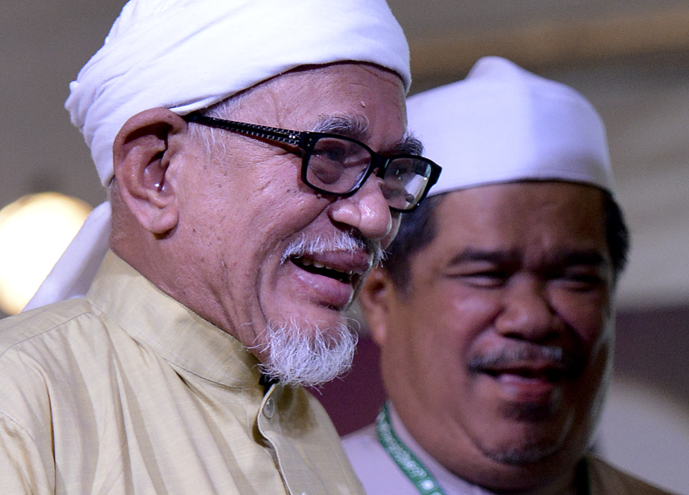 The PAS president and his deputy –  Datuk Seri Abdul Hadi Awang (left) and Mohamad Sabu –  at the party's annual general assembly in September last year. Both party leaders will be at the opposition coalition Pakatan Rakyat's Leadership Council meeting on Sunday. – The Malaysian Insider pic, February 6, 2015.