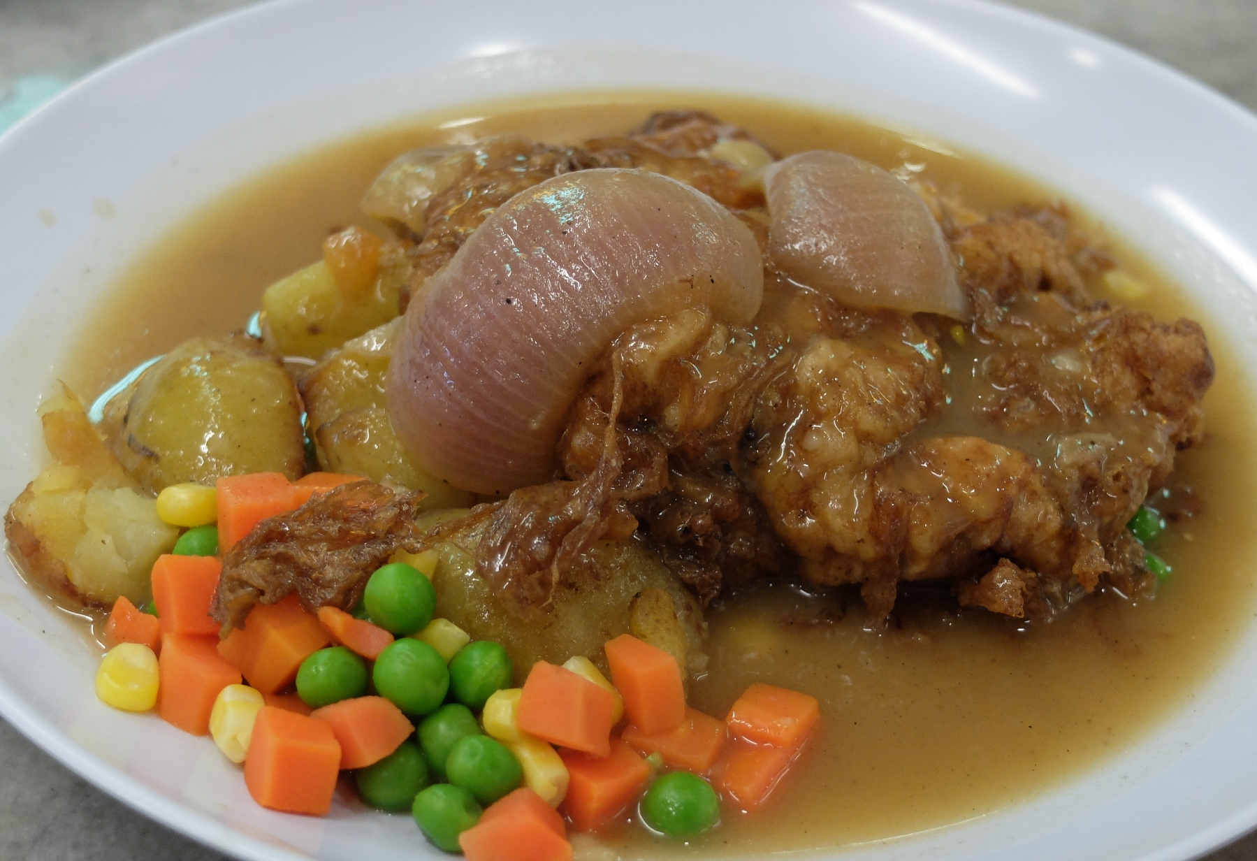 The classic and much loved Hainanese Chicken Chop. – The Malaysian Insider pic, August 30, 2015. 