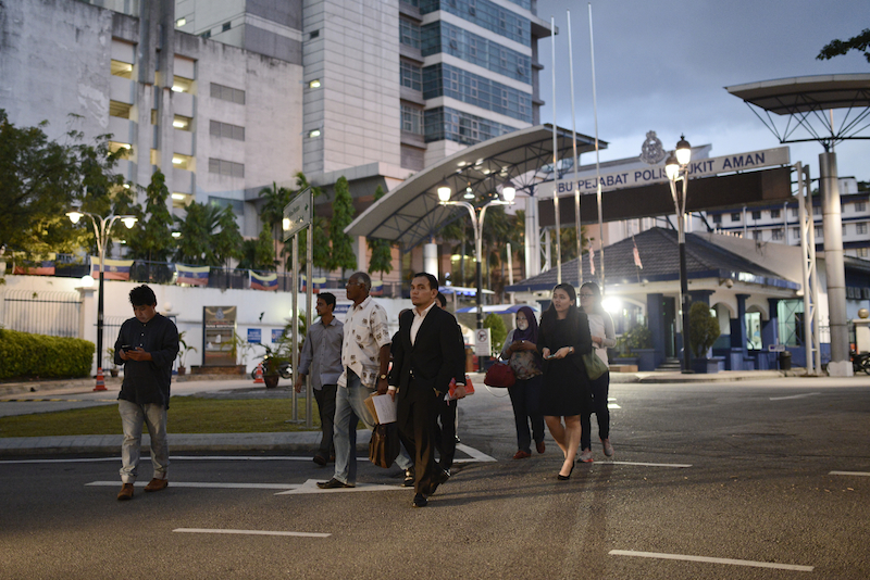 The Malaysian Insider chief executive officer Jahabar Sadiq (left) and other TMI staff leave the Bukit Aman police headquarters after giving their statements over a report which has allegedly caused 'public confusion'. Amnesty International says blocking TMI is a misuse of the criminal justice system. – The Malaysian Insider file pic, February 27, 2016.