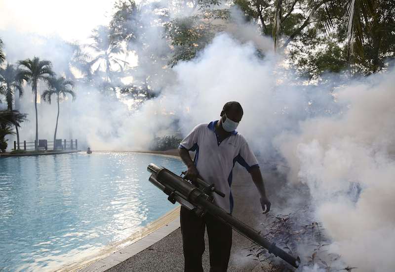 A municipal worker undertakes anti-Aedes fogging in Kuala Lumpur. The government says dengue cases are expected to spike this year. – Reuters pic, March 3, 2016.