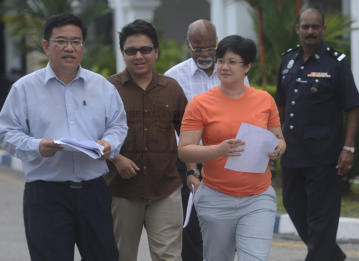 (From left) Penang Chief Minister Lim Guan Eng's political-secetary cum Air Itam assemblyman Wong Hon Wai, Bukit Bendera Dapsy chief Hohd Hariszuan,  Batu Uban assemblyman Dr. T. Jayabalan and Pulau Tikus assembly member Yap Soo Huey leaving Penang Northeast Police headquarters after lodging a police report on an allegation by Penang Umno youth that Gurney Drive will be renamed Chin Peng drive. – The Malaysian Insider pic by Hasnoor Hussain, December 4, 2014.