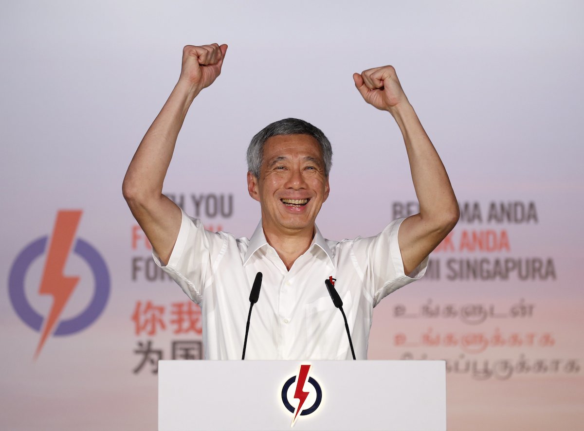 Singapore prime minister Lee Hsien Loong celebrating his party PAP's victory in the island republic's general election on September 11. He has made some radical changes to his Cabinet line-up for the next 4 years. – Reuters pic, September 28, 2015.