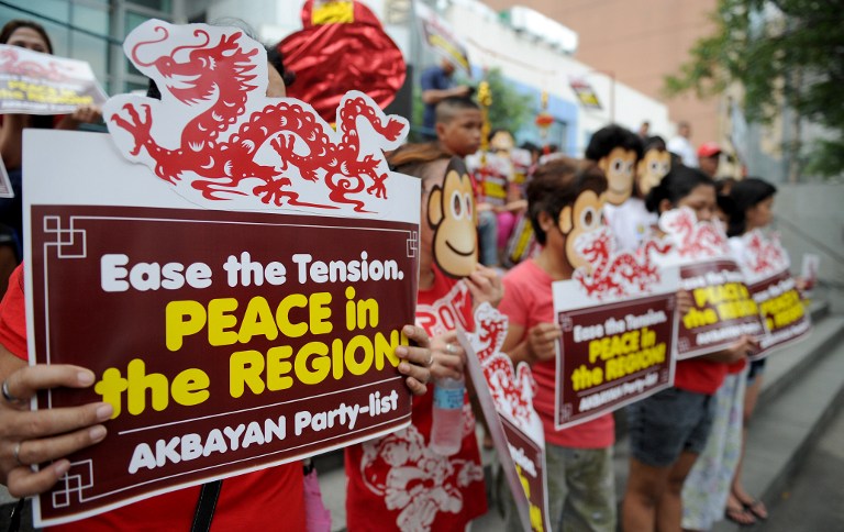 Activists with placards during a rally against Beijing’s island-building in the South China Sea at the Chinese consulate in Manila on February 5. China’s presence in Southeast Asian waters has created unease with the Chinese ambassador to Malaysia meeting the Sarawak chief minister over the matter. – AFP pic, February 15, 2016.