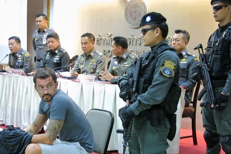  Xavier Andre Justo (seated) has accused The Edge Media Group of not paying him for information on the 1Malaysia Development Berhad-PetroSaudi International joint venture. – Royal Thai Police pic, July 24, 2015. 