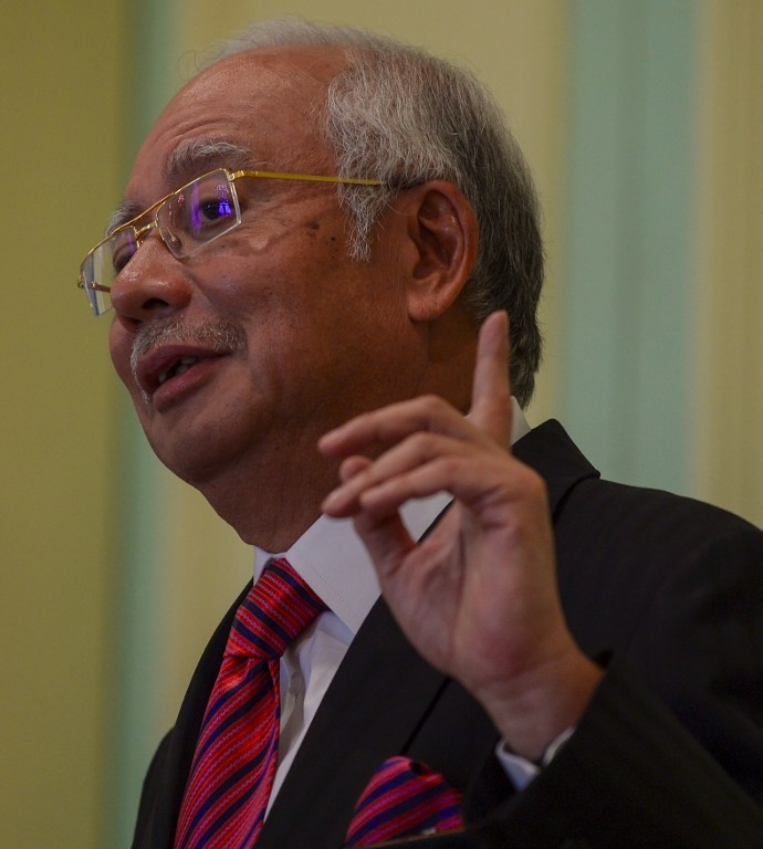 Critics were quick to dismiss Datuk Seri Najib Razak's call to regulate political funds, coming in the middle of a controversy over massive funds transferred to his personal bank accounts. – AFP pic, August 15, 2015.