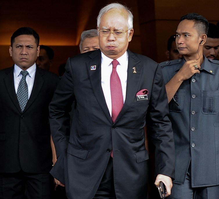 Datuk Seri Najib Razak, fresh from being declared innocent a day earlier in the RM2.6 billion 'donation' saga, leaves the Parliament building today. Former leader Tun Dr Mahathir Mohamad has described the decision by the A-G yesterday as a 'judgment'. – AFP pic, January 27, 2016.