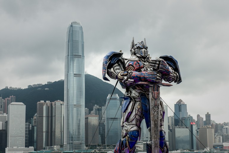 An Optimus Prime figure displayed in front of the city skyline before the world premiere of'Transformers 4' movie in Hong Kong. Three more sequels are set to arrive by 2019. – AFP/Relaxnews pic, February 13, 2016.