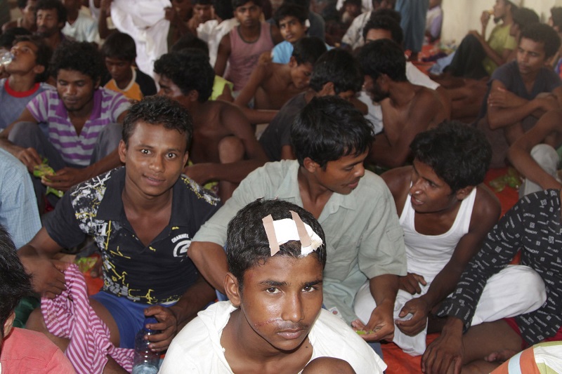 A group of Rohingya and Bangladeshi migrants, who arrived in Indonesia by boat today, gather in temporary shelter in Langsa, Aceh. – Reuters pic, May 15, 2015.