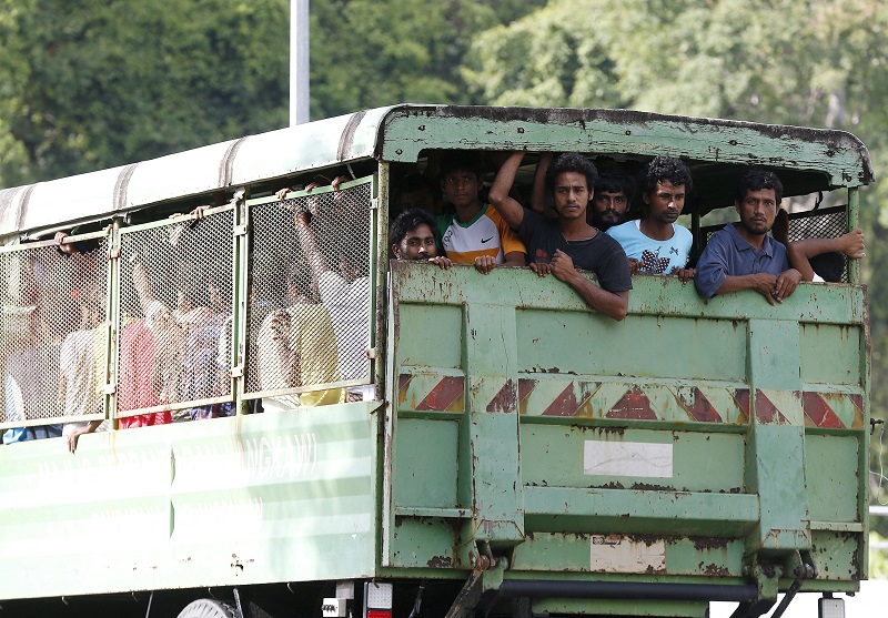 Rohinyga and Bangladeshi refugees are transported to a navy boat where they will be taken to mainland Malaysia, after they landed at Pantai Pasir Berdengung beach in Langkawi. – Reuters pic, May 14, 2015.