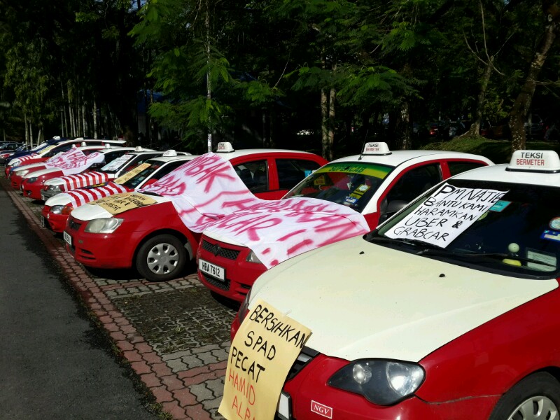 Banners covering some of the taxis at the rally in Padang Merbok. – The Malaysian Insider pic by Low Han Shaun, November 18, 2015.