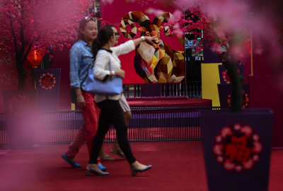 Visitors walk past decoration of a goat at a shopping complex in Kuala Lumpur. - The Malaysian Insider pic by Nazir Sufari, February 18, 2015.