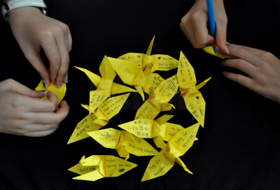 People folding origami and writing messages on them for passengers on MH370 in Penang on March 14, 2014. – The Malaysian Insider pic by Hasnoor Hussain, April 8, 2014.