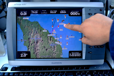 A Malaysian Maritime Enforcement personnel pointing to a screen radar of the possible crash site before departing from their base during search and rescue operations for the missing Malaysia Airlines flight MH370 in Tok Bali, Pasir Puteh, Kelantan, on March 12, 2014. – The Malaysian Insider pic by Najjua Zulkefli, April 8, 2014.